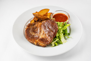 steak with baked potatoes and salad