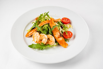 Fototapeta na wymiar salad with shrimps on the white background