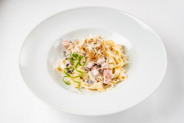 Carbonara pasta, spaghetti with pancetta, egg, hard parmesan cheese and cream sauce.