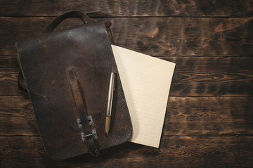 Blank paper page on a wooden board background. Old letter mockup.
