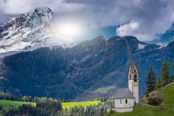 Fototapeta na wymiar Magnificent summer sunset in Tirol. Chapel of St. Mary Magdalene