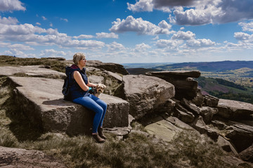 Naklejka na ściany i meble Woman Watching the View at Derbyshire rocks
