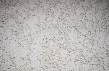 Textured textured gray uneven wall as a background with veins