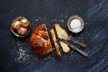 Easter plait, coarse sugar and Easter eggs, from above