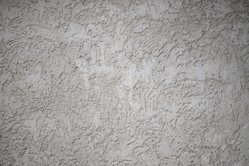 Textured textured gray uneven wall as a background with veins