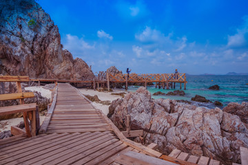 Koh kham island and wood bridge with blue sky and clear water at Chonburi Thailand.