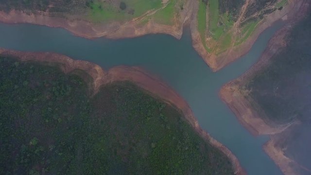 Aerial. Flying drone in fog and clouds over the hills in Monchique Portugal.