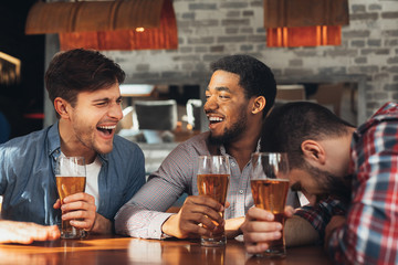 Friends Meeting. Men Drinking Beer And Talking In Bar