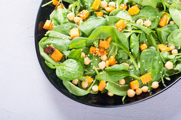 autumn salad with pumpkin , spinach , chickpea and sesame