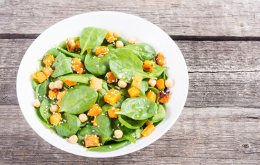 autumn salad with pumpkin , spinach , chickpea and sesame