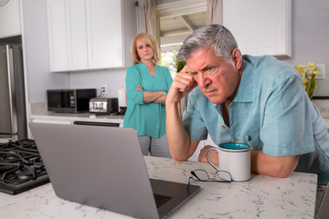 Older senior married couple in distress, concerned over mortgage, finances, financial earnings, debt