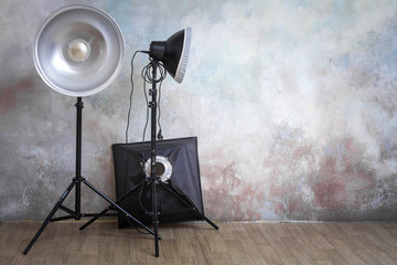 Professional lighting equipment in the photo studio on the original gray background
