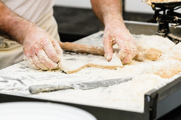 A man makes Irish traditional soda bread farls, common in most of Ireland, but particularly in...