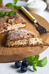 Gluten free hand pies with cottage cheese filling without sugar with fresh blueberries and mint.  Healthy dessert, pastry.