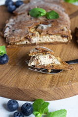 Gluten free hand pies with cottage cheese filling without sugar with fresh blueberries and mint.  Healthy dessert, pastry.