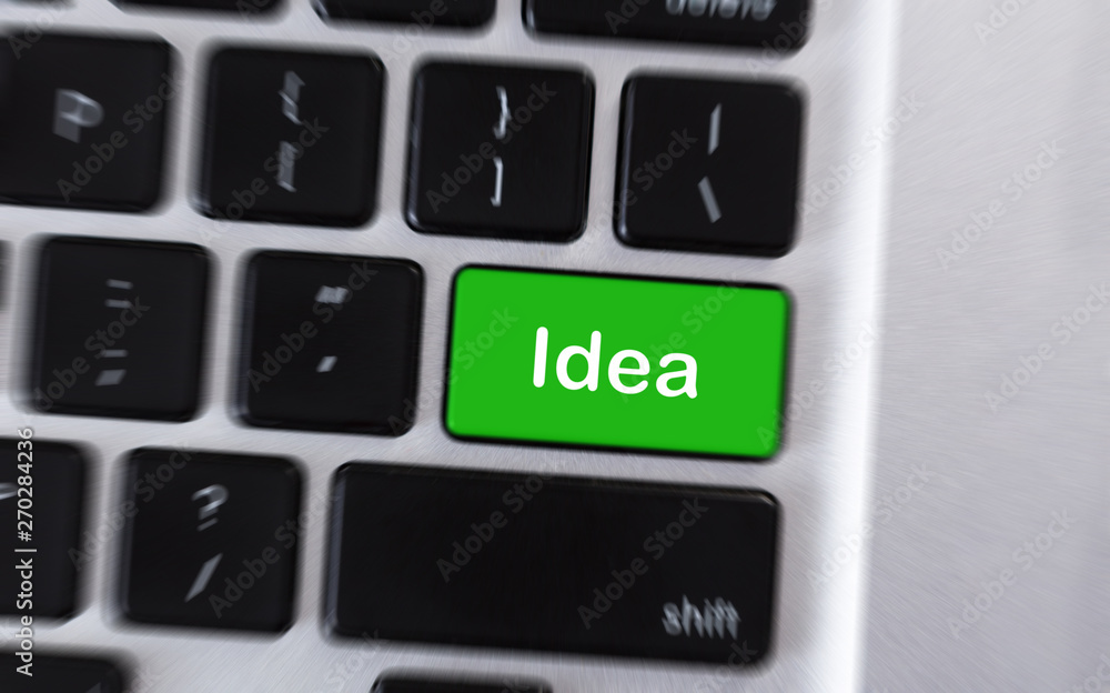 Aufkleber Text Idea on green button of computer keyboard