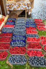 Berries closeup in trays for sale