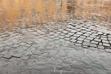 Puddles on the pavement close up