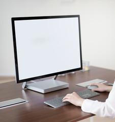 Woman's hand holding a mouse for office design work