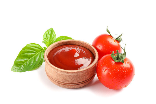 Fresh cherry tomatoes with basil and souce isolated on white background. Ripe vegetables