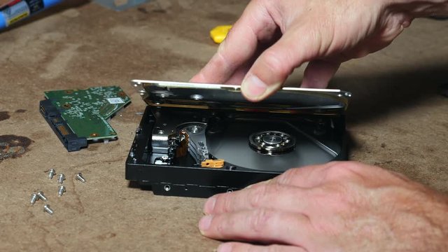 DIY hard disk drive repair opening case to inspect internal parts