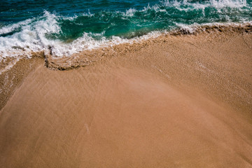 Waves meeting the sand 