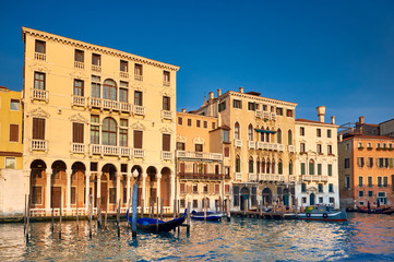 Old houses by Grand Canal in Venice, Italy, on a bright day