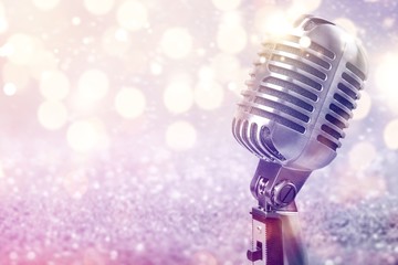 Retro style microphone on  background