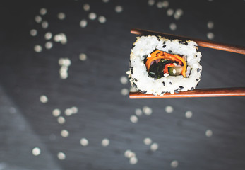 Sushi served with chopstcks