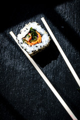 Sushi served with chopstcks