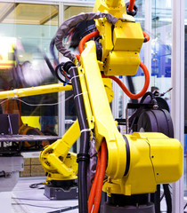 Moving part of robotic arm machine tool back view close up