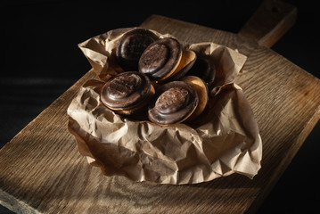 Chocolate cookies on the old wooden cutting desk