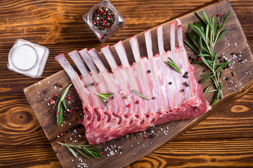 Raw rack of lamb with spices and herbs