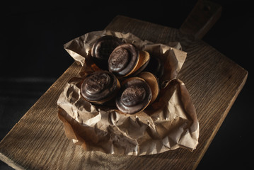 Chocolate cookies on the old wooden cutting desk
