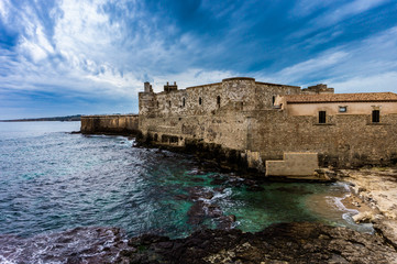 Coast line of Ortigia island at city of Syracuse, Sicily, Italy.