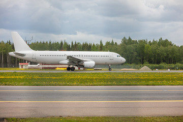 white passenger plane lands at the airport