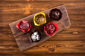 Fototapeta na wymiar Colorful chocolate homemade muffins