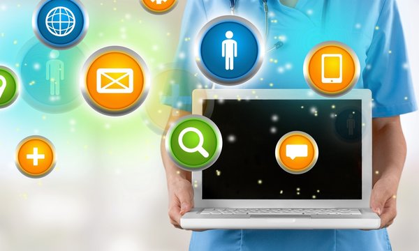 Close-up Doctor at hospital working with laptop