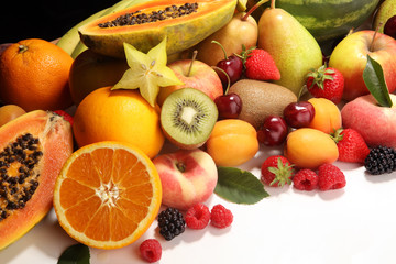 Fresh summer fruits with apple, peach, papaya, berries, pear and apricot.