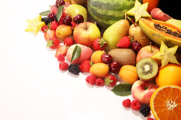 Fresh summer fruits with apple, peach, papaya, berries, pear and apricot.