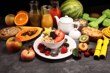 Healthy breakfast. Bowl of yogurt with granola and berries, fresh fruits and smootihies