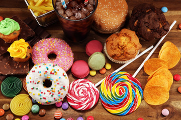 Unhealthy products with sugar. food bad for figure, skin, heart and teeth.