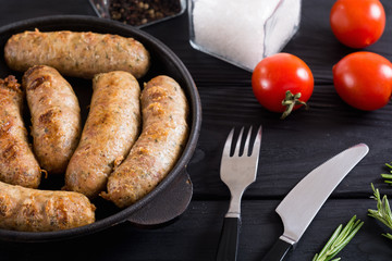 Grilled sausages with tomatoes , pepper and rosemary