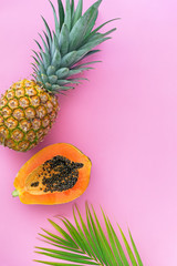 Pineapple, papaya, and mango flat lay.