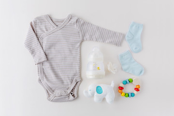 Baby goods on light pastel background