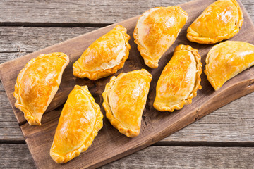 Latin American baked beef empanadas with sauce