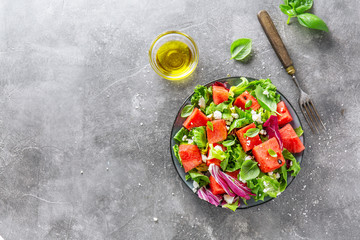 Summer salad with watermelon and salad leaves