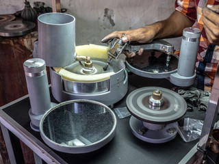 Man's hand edging gem. Sri Lanka, March 18, 2019.