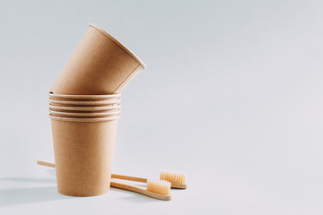 Zero waste concept with paper cups and toothbrushes