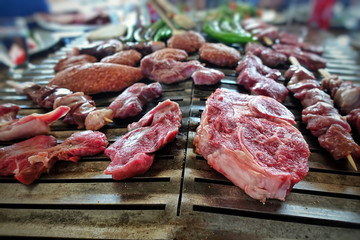 Mixture of Raw Meat on Barbecue